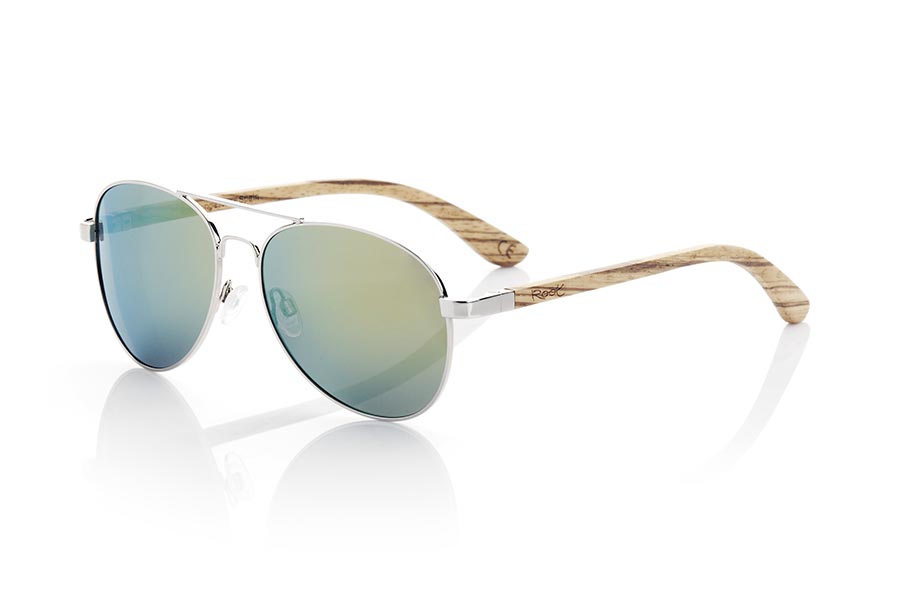 Gafas de Madera Natural de Zebrano BONIN. Las gafas de sol BONIN están fabricadas con la montura metálica plateada y las varillas en madera de Zebrano natural. Un modelo clásico estilo Aviator combinadas de serie con una gama de varias lentes. Te encantará la combinación en madera de zebra. Medida frontal: 150x50mm Venta al Por Mayor y Detalle | Root Sunglasses® 